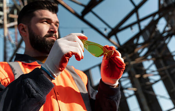 Woman reviewing a mechanical engineer's work on a computer